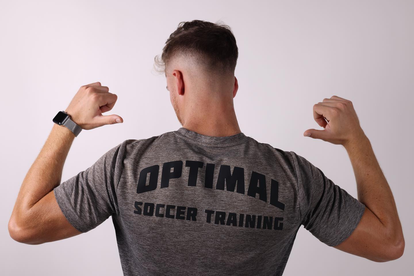 Optimal Soccer Training model wearing training apparel.
