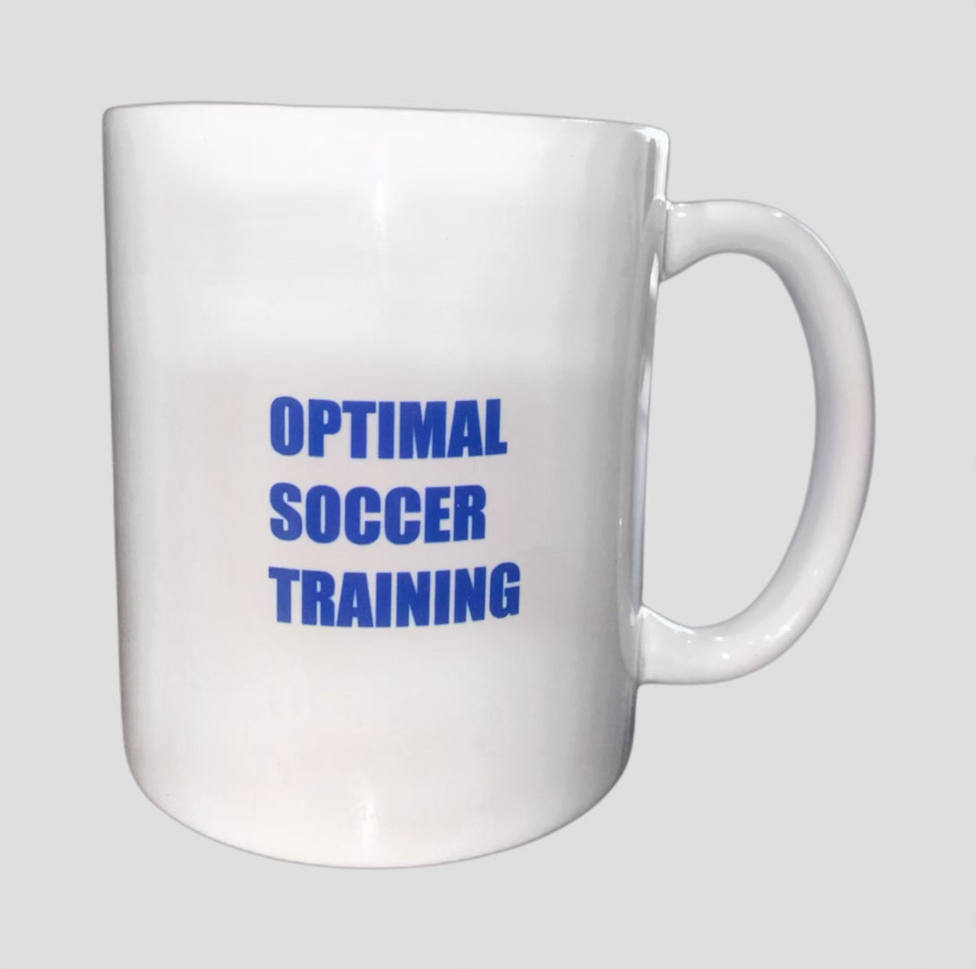 A white Optimal Soccer Training mug showcasing the brand name, ideal for enjoying hot beverages while embracing the soccer spirit.